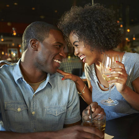 Man and woman conversing in a bar