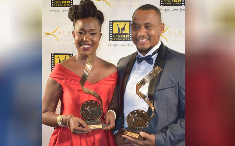 Actors Diana Mulwa and Eddy Peter with their award