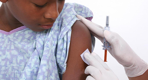 African girl being injected on