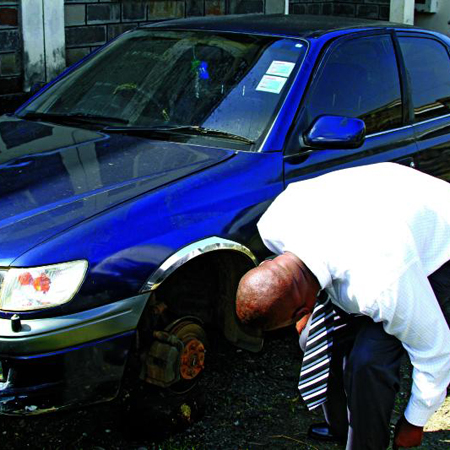 Nakuru Advertising manager checking his car