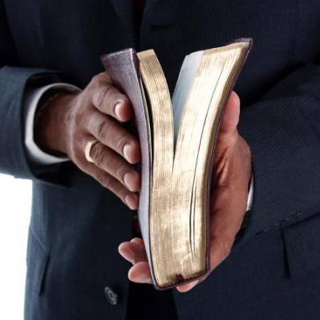Pastor holding bible