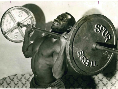 Body builder lifting weight
