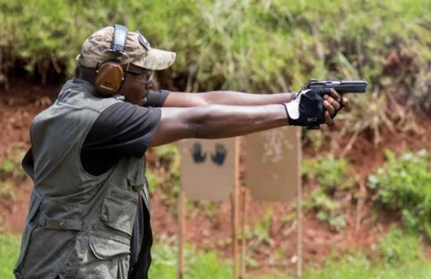 Man aiming during a past gun shooting competition